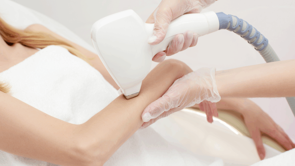 Laser hair removal treatment on a woman’s arm at a professional clinic in Islamabad