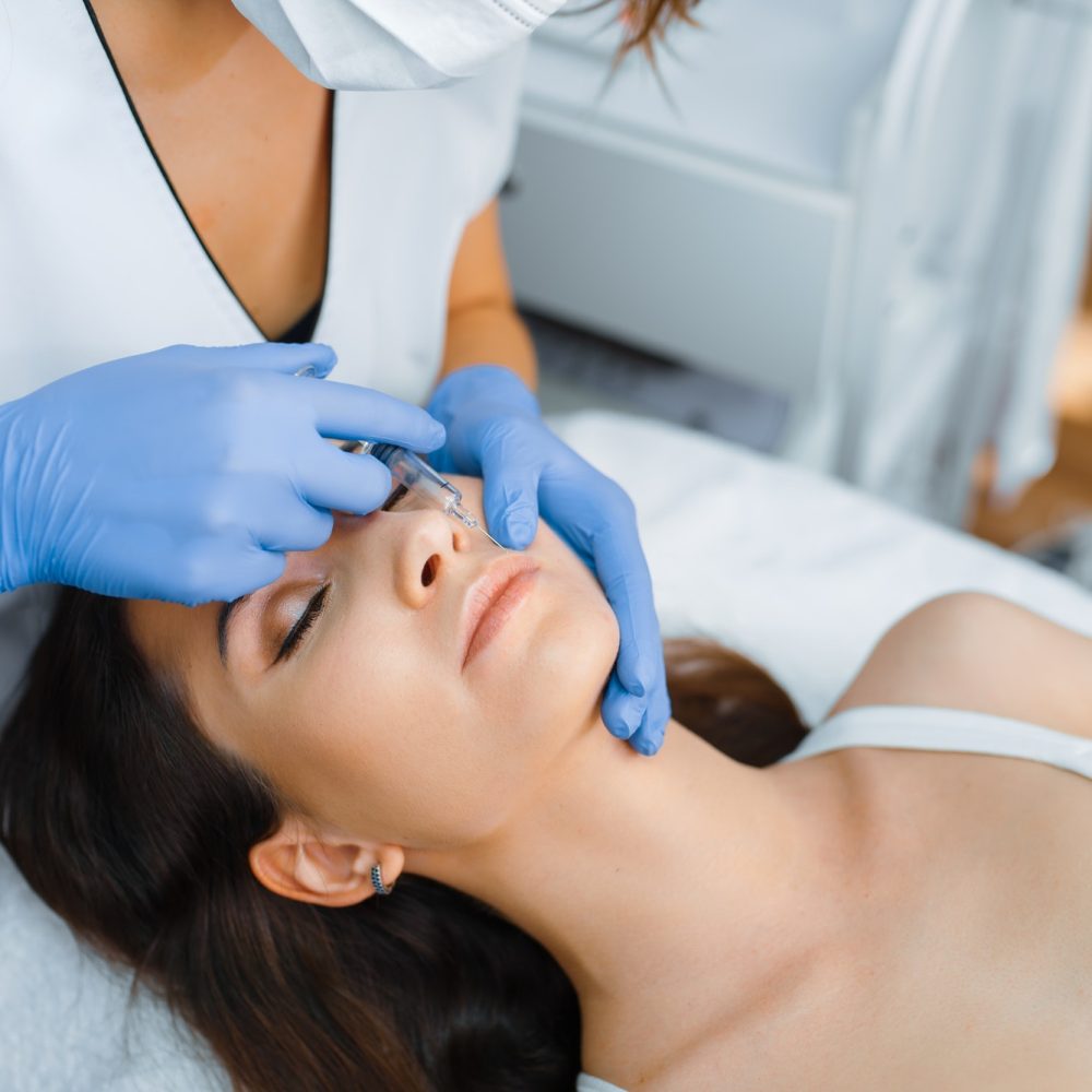 cosmetician-gives-face-botox-injections-to-patient.jpg